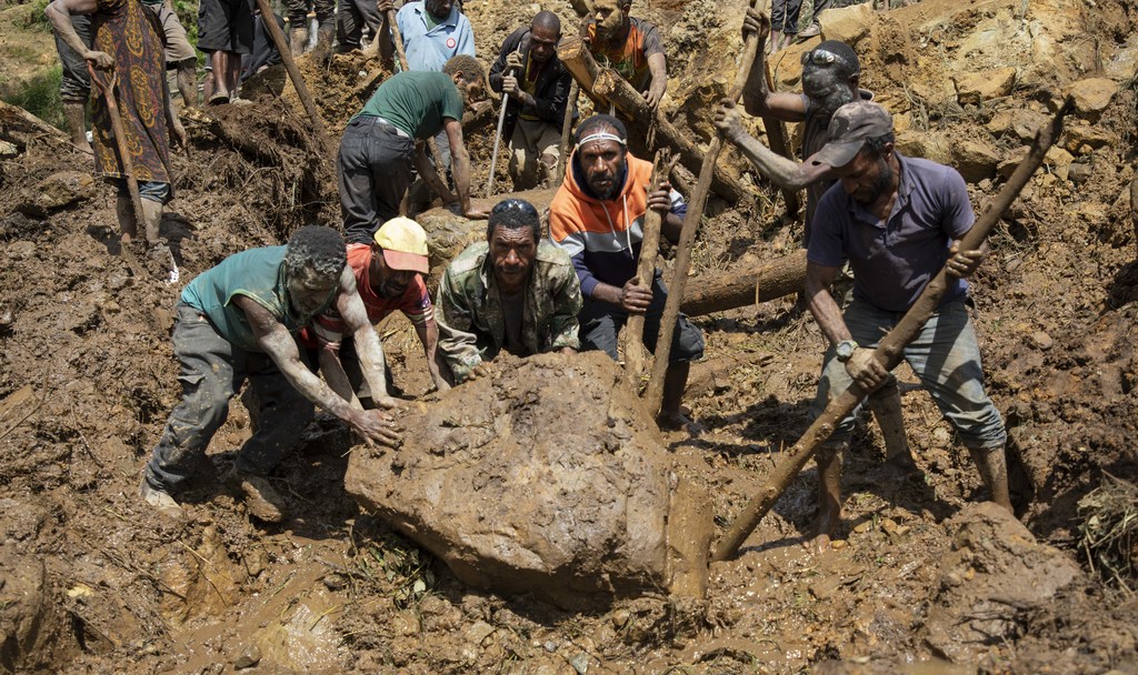 Rescue workers at the site of the the May 25 landslide in northern Papua New Guinea.